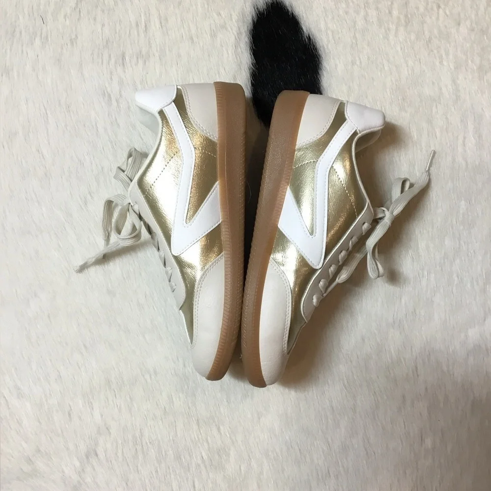DV by Dolce Vita Quantum sneakers in a gold and white/tan colorway